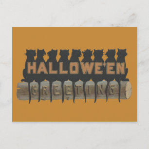 Zwarte kat zittend op log schaduw briefkaart