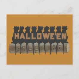 Zwarte kat zittend op log schaduw briefkaart