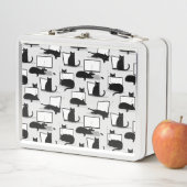 Zwarte katten die op het laptoppatroon zitten (In situ)