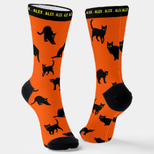 Zwarte katten op Oranje Sokken
