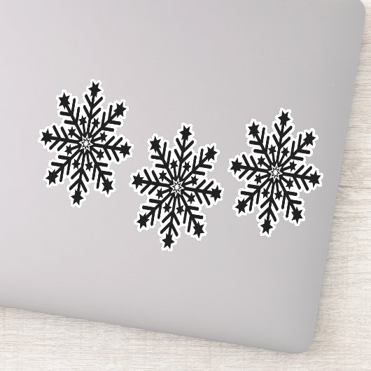 Zwarte kerstsneeuwvlokken op sticker (Detail)