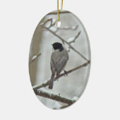 Zwarte kerstversiering met een kapotte kip keramisch ornament (Links)