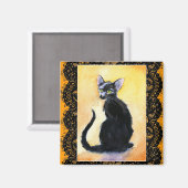 Zwarte kittenkat, kant, oranje magneet (Voorkant / Achterkant)