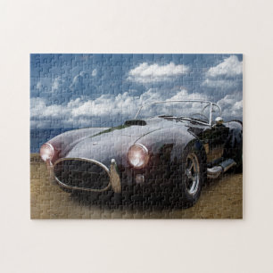 Zwarte kobra op de strand, klassieke auto legpuzzel