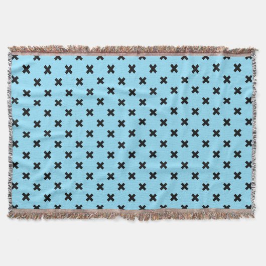 Zwarte kruisstift op babyblauw deken (Voorkant)