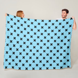 Zwarte kruisstift op babyblauw fleece deken