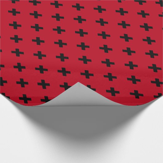 Zwarte kruisstift op rood cadeaupapier (Hoek)