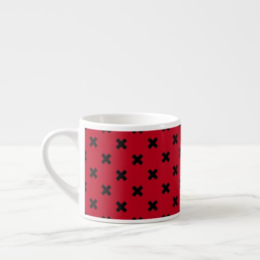Zwarte kruisstift op rood espresso kop (Links)
