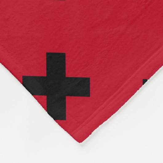 Zwarte kruisstift op rood fleece deken (Hoek)