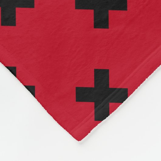 Zwarte kruisstift op rood fleece deken (Hoek)