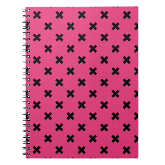 Zwarte kruisstiften op fuchsia notitieboek (Voorkant)