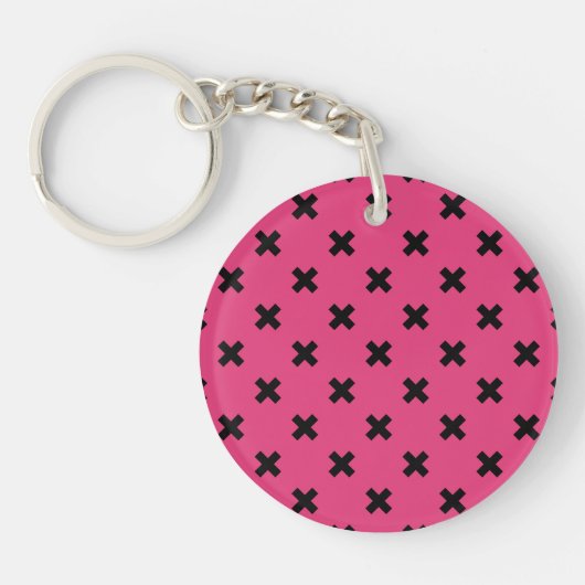Zwarte kruisstiften op fuchsia sleutelhanger (Voorkant)