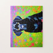 Zwarte labrador in een bloementveld legpuzzel (Verticaal)