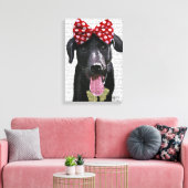 Zwarte labrador met rode bol aan kop canvas afdruk (Insitu (Woonkamer))