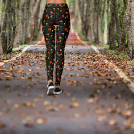Zwarte legging met patroon van rode klaprozen blad