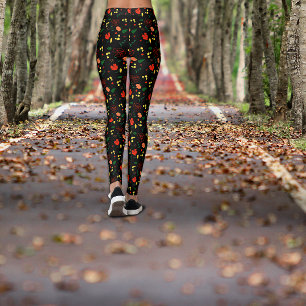 Zwarte legging met patroon van rode klaprozen blad