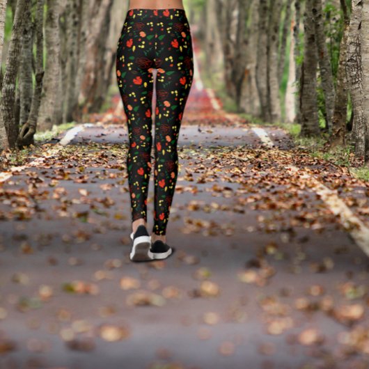 Zwarte legging met patroon van rode klaprozen blad