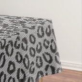 Zwarte netzijde met luipaard op wit tafelkleed (Voorbeeld)