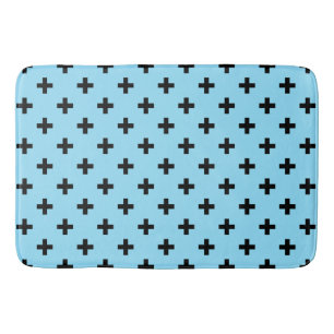 Zwarte polka kruist op babyblauw badmat