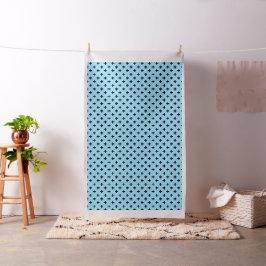 Zwarte polka kruist op babyblauw stof