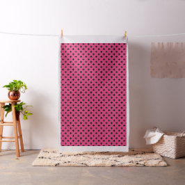 Zwarte polka kruist over fuchsia stof
