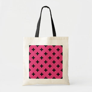 Zwarte polka kruist over fuchsia tote bag