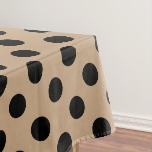 Zwarte polka-punten op beige tafelkleed