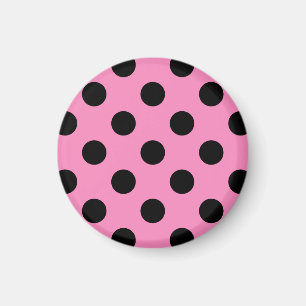 Zwarte polka-stippen op roze magneet