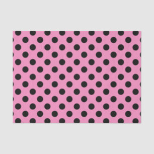 Zwarte polka-stippen op roze tissuepapier