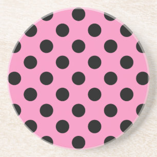 Zwarte polka-stippen op roze zandsteen onderzetter