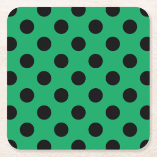 Zwarte polka-stippen op vers groen kartonnen onderzetters