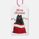 Zwarte pommeraanse hond in Santa Bag Cadeaulabel (Voorkant)