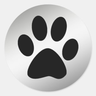 ZWARTE POOTPRINT OP ZILVER RONDE STICKER