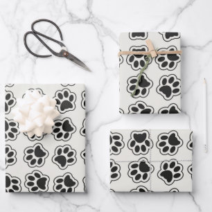 Zwarte poten, hondenpoten, kattenpoten, omtrek inpakpapier vel