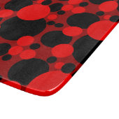 Zwarte rode gestippelde cirkels glazen snijplank (Hoek)