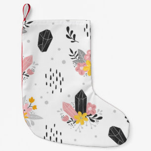 Zwarte, roze kristallen, bloemennaadloos. kleine kerstsok