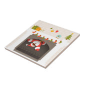 zwarte santa zit vast in haard tegeltje (Zijkant)