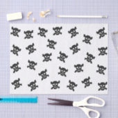 Zwarte schedel en kruisbeenderen op wit tissuepapier (Craft)