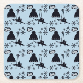 Zwarte ski-uitrusting & sneeuwvlokken op blauw kartonnen onderzetters