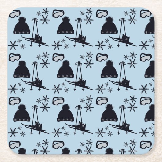 Zwarte ski-uitrusting & sneeuwvlokken op blauw kartonnen onderzetters (Voorkant)