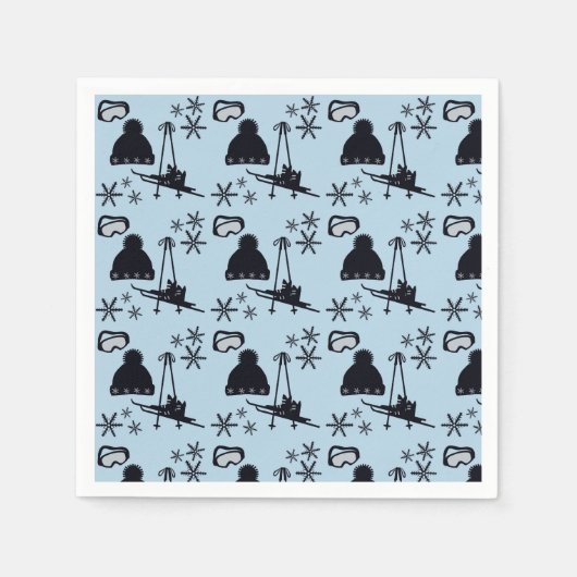 Zwarte ski-uitrusting & sneeuwvlokken op blauw servet (Voorkant)