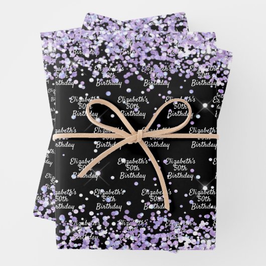 Zwarte verjaardag met paarse lavendel glitters naa inpakpapier vel (In situ)