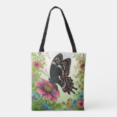 Zwarte vlinder geniet van bloemen in de tuin tote bag (Achterkant)