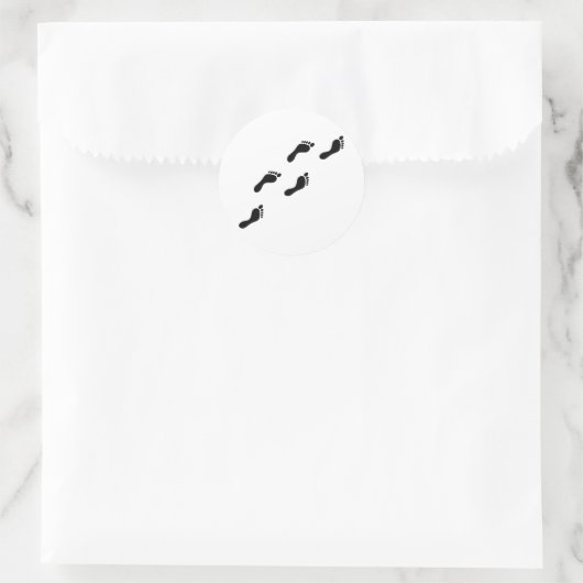 zwarte voetafdrukken ronde sticker (Tas)