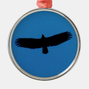 Zwarte vogel in een blauwe hemel metalen ornament