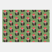 Zwarte vrouwen, rode kerstmuts, kauwgom, vrolijk k inpakpapier vel (Voorkant)