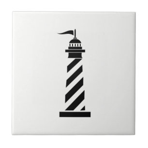 Zwarte vuurtoren op witte keramische tegel tegeltje