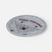 Zwarte weduwe spinnen in driehoek web rustiek wit papieren bordje (Gekanteld)