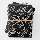 Zwarte, witte kersttypografie en stippen vakantie inpakpapier vel (In situ)