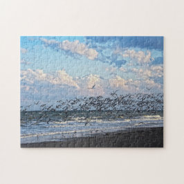 Zwarte zwemmers vertrekken op Kaapzekanaverstrand Legpuzzel